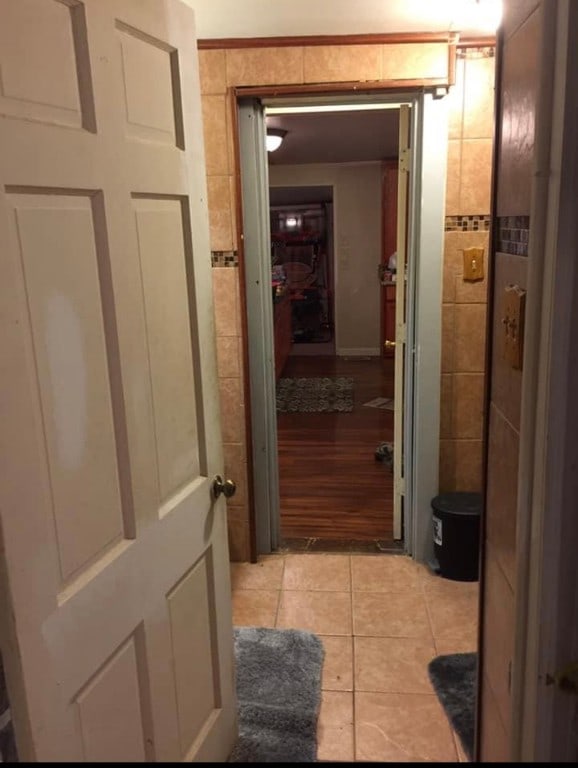 corridor featuring light hardwood / wood-style floors