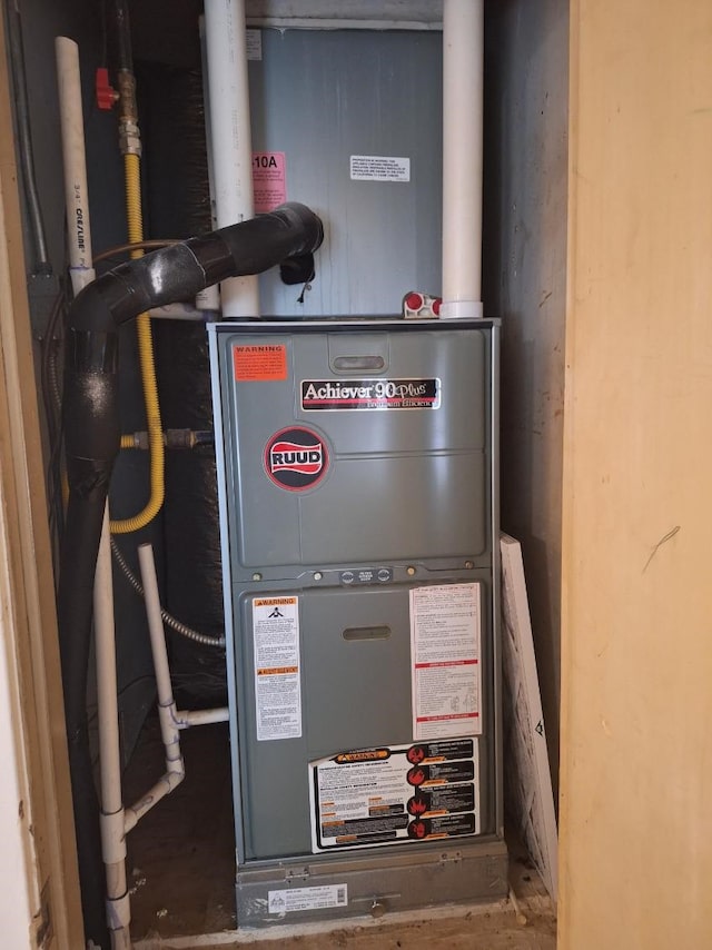 utility room featuring heating unit