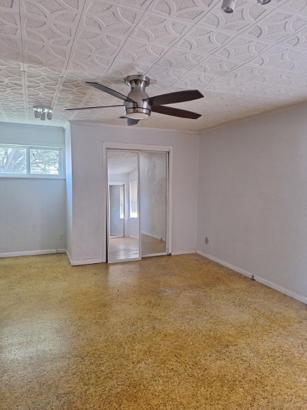 unfurnished room with ceiling fan