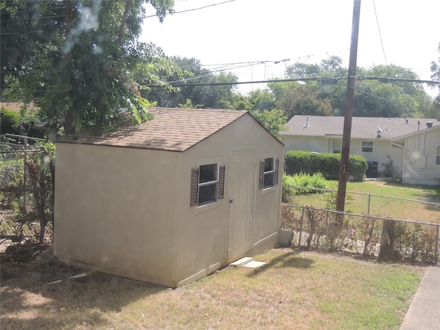 view of outbuilding featuring a yard