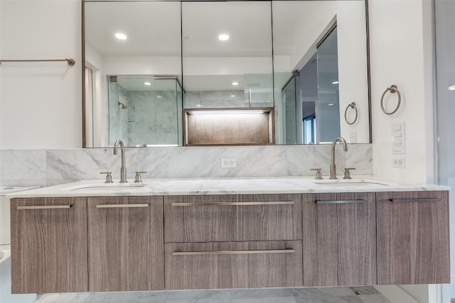 bathroom featuring backsplash, double sink vanity, tile floors, and an enclosed shower