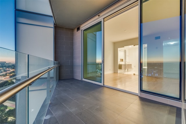 view of balcony at dusk