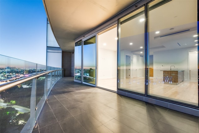 view of balcony at dusk