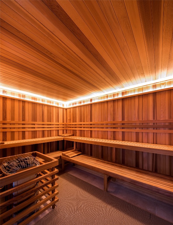 view of sauna featuring wood ceiling and carpet