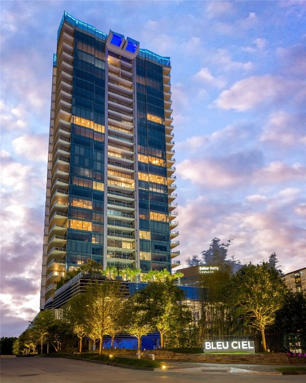 view of outdoor building at dusk