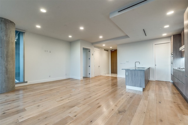 interior space with sink and light wood-type flooring