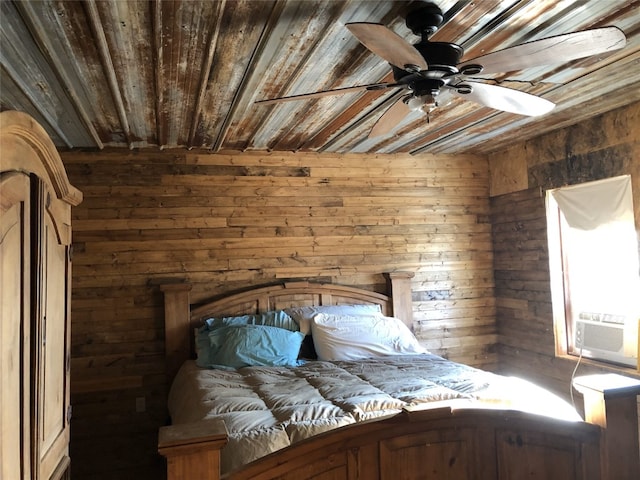 unfurnished bedroom featuring wooden walls, ceiling fan, and wooden ceiling