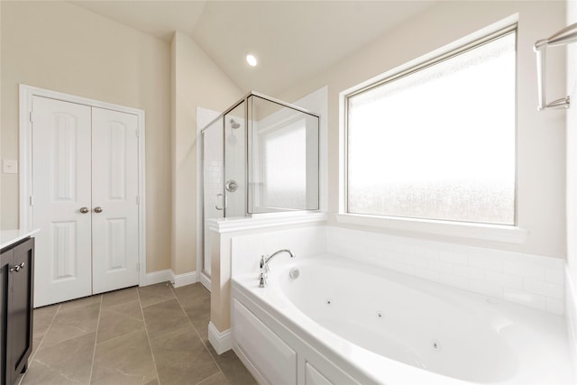 bathroom featuring tile patterned flooring, vanity, lofted ceiling, and shower with separate bathtub