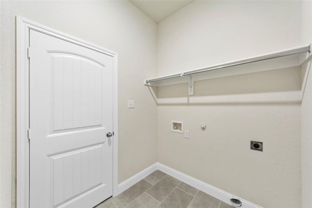 clothes washing area with hookup for an electric dryer, hookup for a washing machine, gas dryer hookup, and light tile patterned flooring