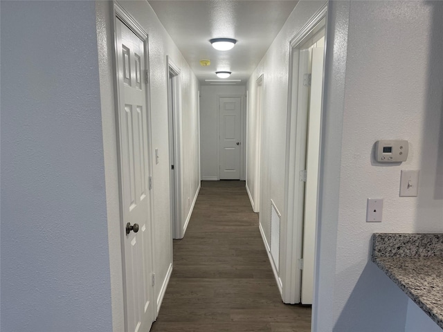 hallway featuring dark hardwood / wood-style floors