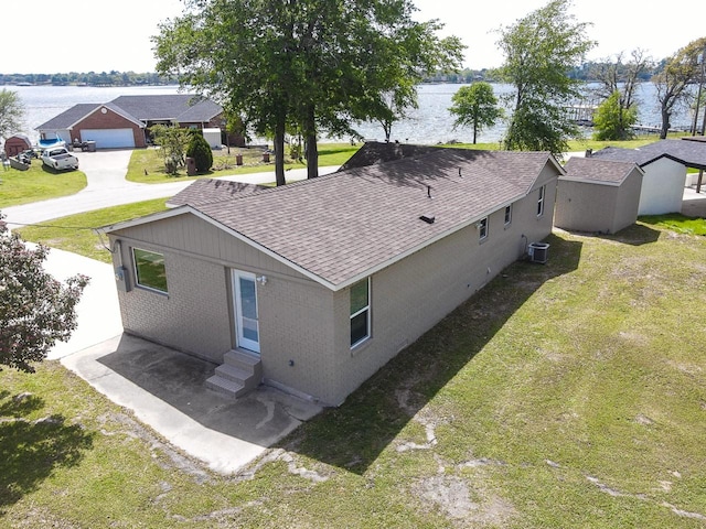 drone / aerial view featuring a water view