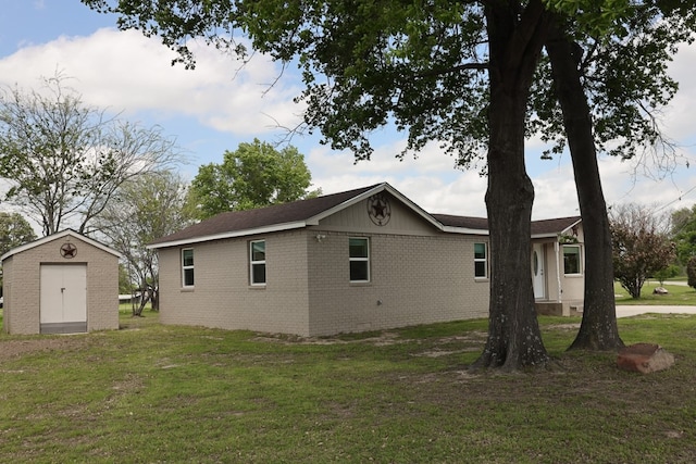 view of home's exterior featuring a shed and a lawn