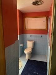 bathroom featuring toilet