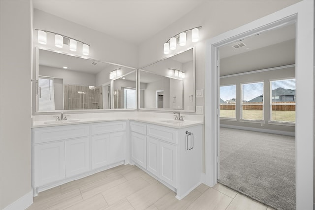 bathroom with tile flooring and dual vanity