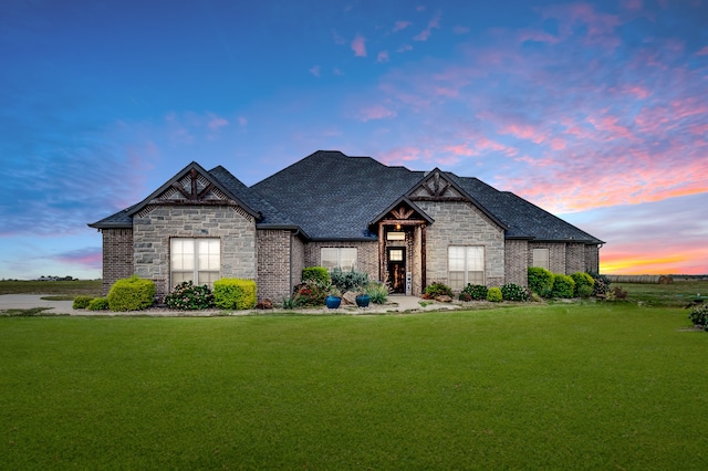 view of front of home with a yard