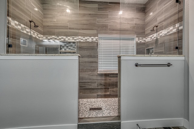 bathroom featuring a tile shower