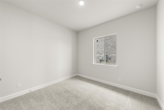 unfurnished room with carpet flooring