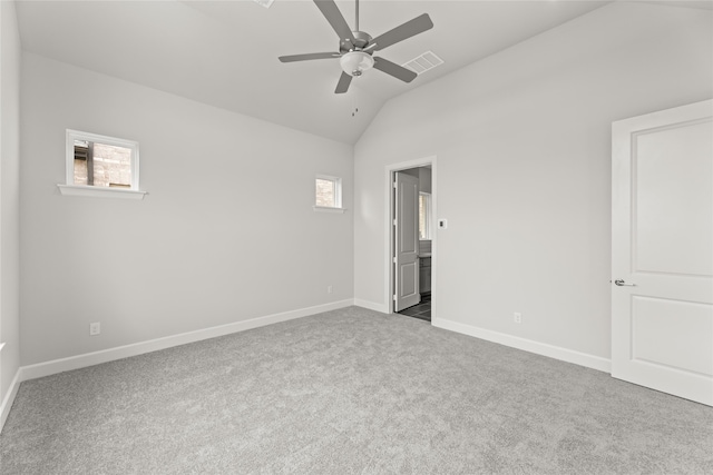 unfurnished bedroom with carpet floors, lofted ceiling, and ceiling fan