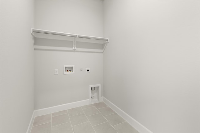 laundry area featuring washer hookup, hookup for a gas dryer, electric dryer hookup, and light tile patterned flooring