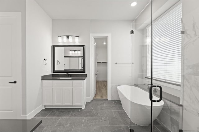 bathroom featuring vanity and plus walk in shower