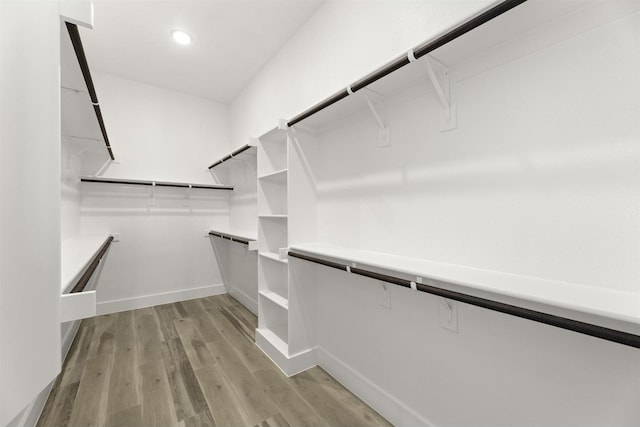 walk in closet featuring light hardwood / wood-style flooring