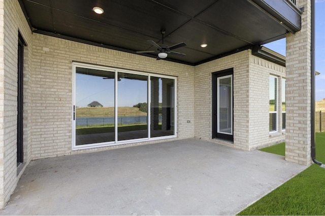 view of patio featuring ceiling fan