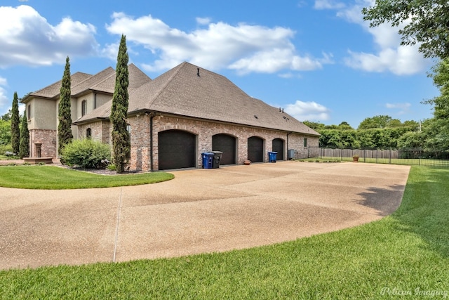 exterior space featuring a garage and a yard