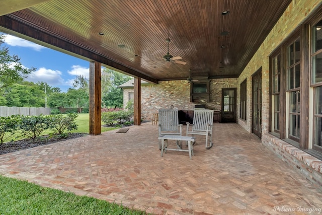 view of patio featuring ceiling fan