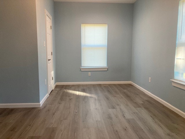 spare room with hardwood / wood-style flooring