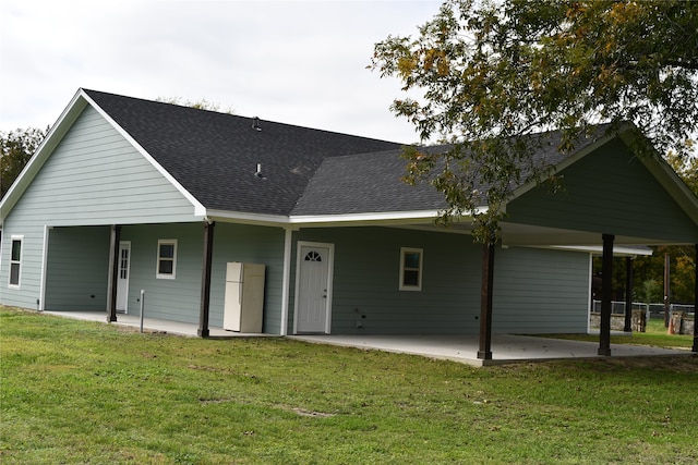 rear view of property featuring a yard