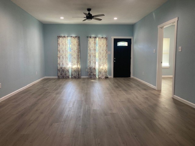 entryway with ceiling fan and dark hardwood / wood-style floors