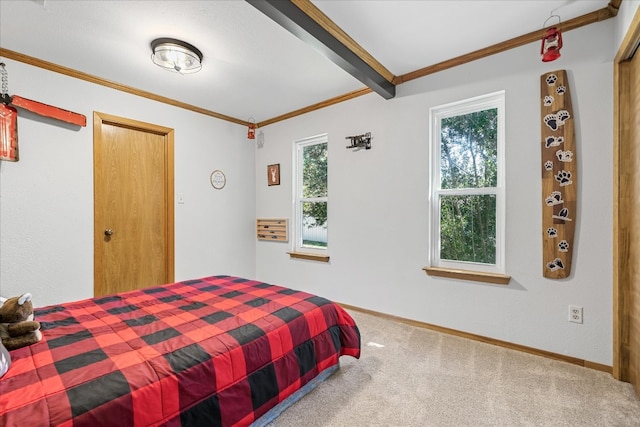 carpeted bedroom featuring multiple windows and beamed ceiling