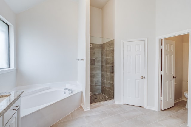 full bathroom with vanity, plus walk in shower, toilet, and tile patterned floors