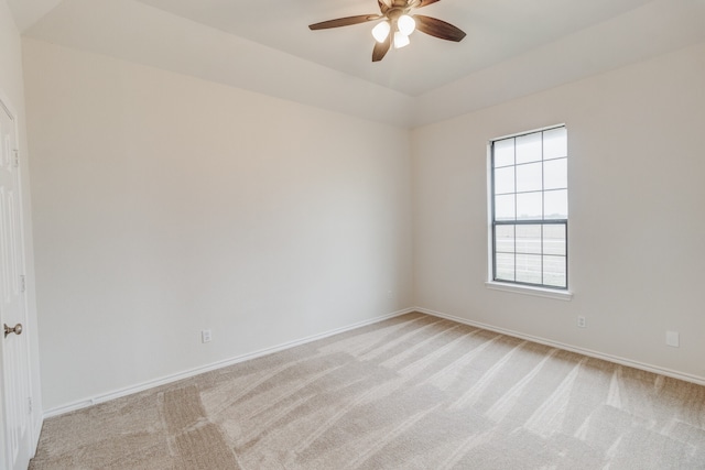 unfurnished room featuring ceiling fan and light colored carpet