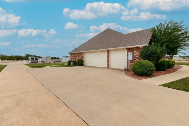 view of side of home with a garage