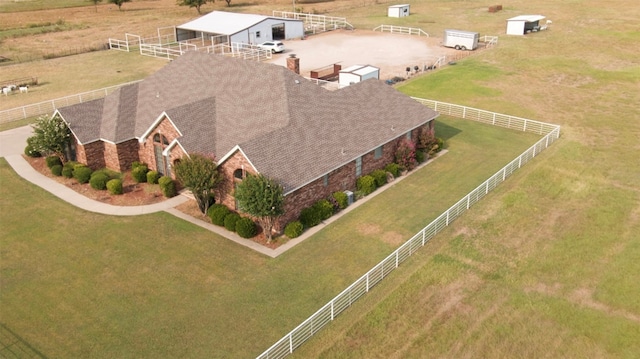 birds eye view of property with a rural view