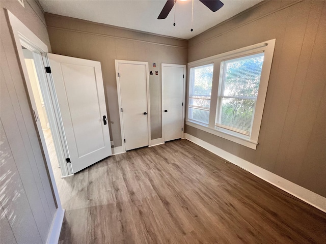 unfurnished bedroom with ceiling fan and light hardwood / wood-style flooring