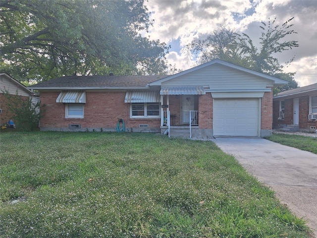 single story home with a garage and a front lawn