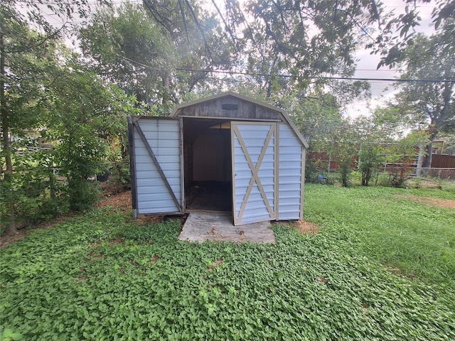 view of outdoor structure with a yard