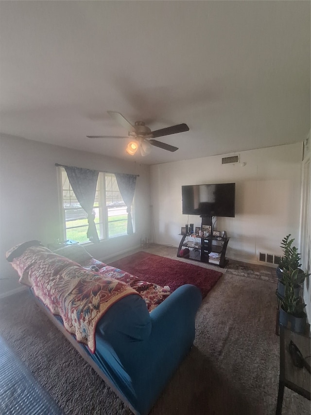 living room with carpet and ceiling fan