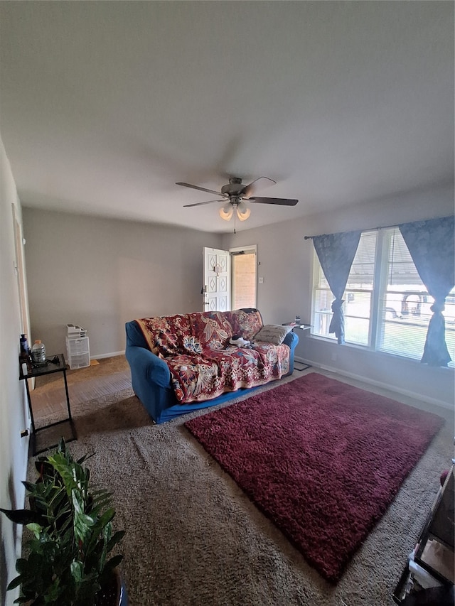 living room with carpet flooring and ceiling fan