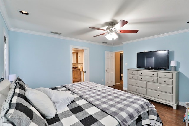 bedroom featuring dark hardwood / wood-style flooring, ensuite bathroom, ceiling fan, and ornamental molding