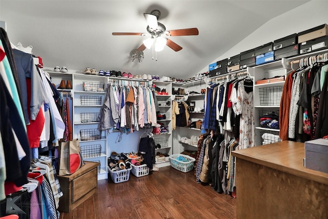 walk in closet with wood-type flooring, vaulted ceiling, and ceiling fan