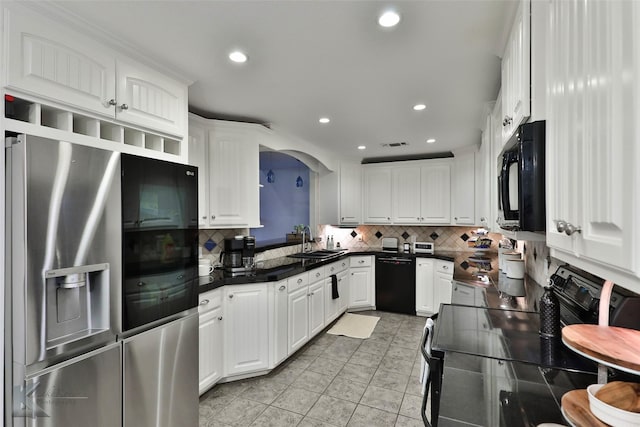 kitchen featuring backsplash, sink, black appliances, white cabinets, and light tile patterned flooring