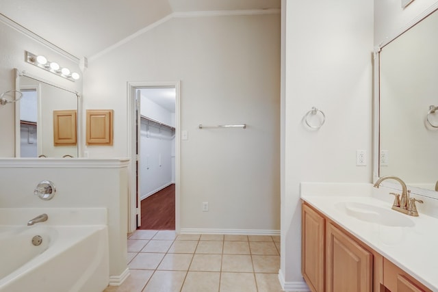 bathroom with vanity, lofted ceiling, a bath to relax in, tile flooring, and crown molding