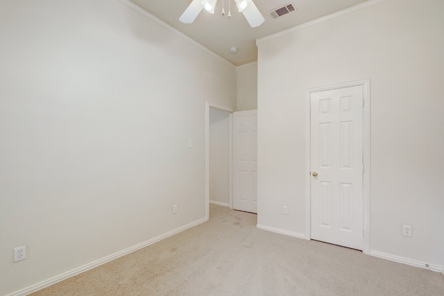 unfurnished bedroom with light carpet and ceiling fan