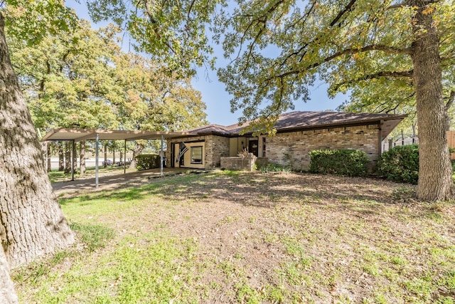 exterior space with a carport