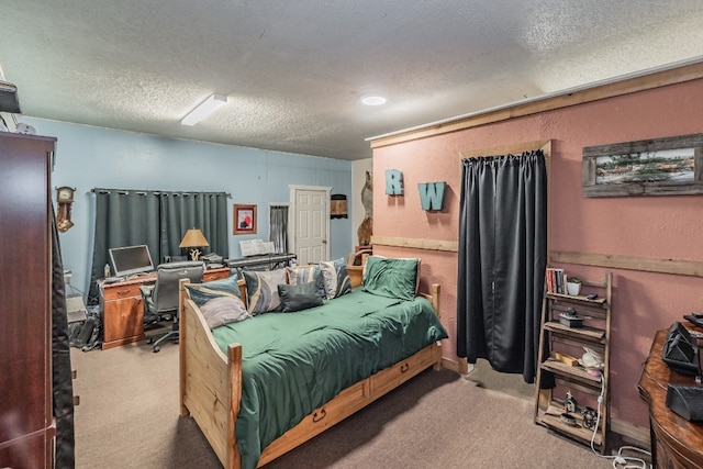 carpeted bedroom featuring a textured ceiling