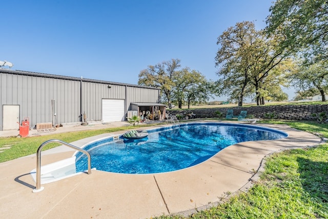 view of pool with a garage