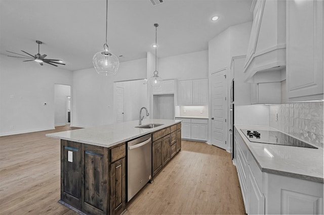 kitchen with stainless steel dishwasher, dark brown cabinets, white cabinetry, and sink